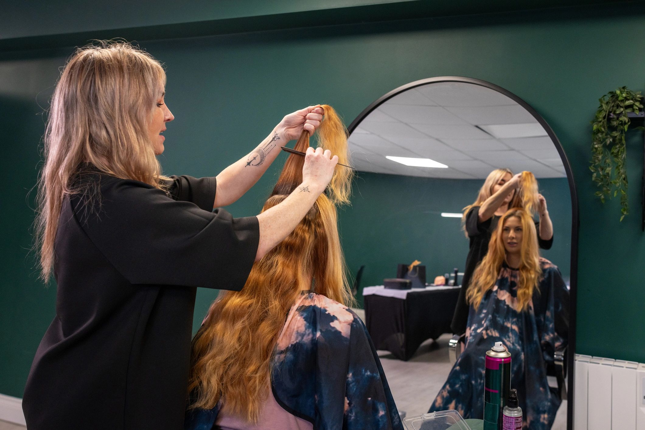 Client receiving a haircut and styling service in a salon